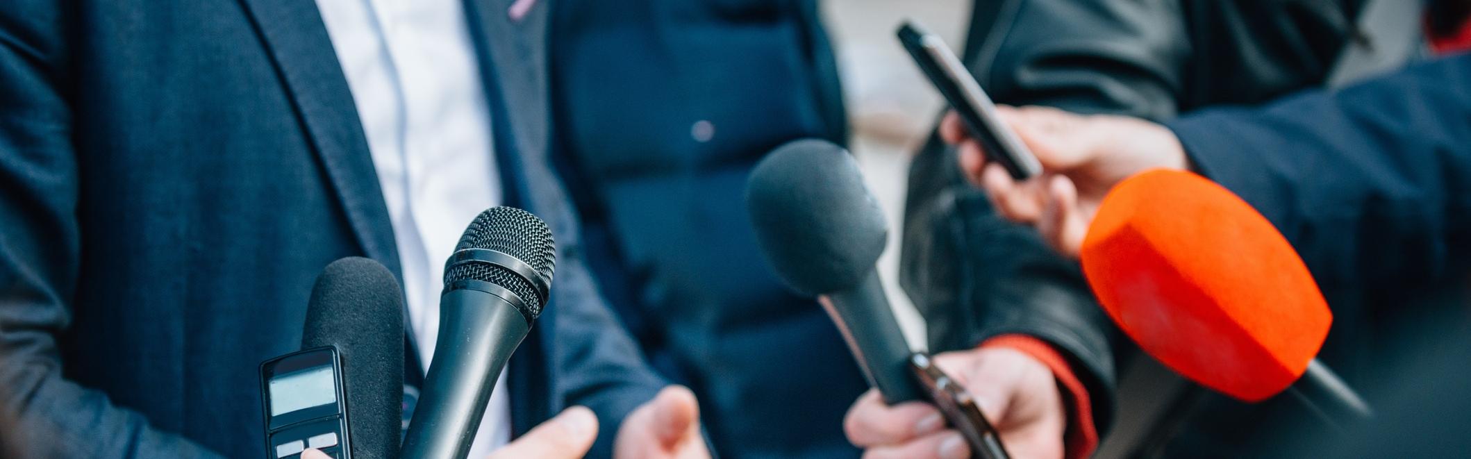 Man talking to press